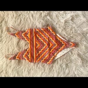 Unique and sexy one piece. Worn one time. Super deep V cut.